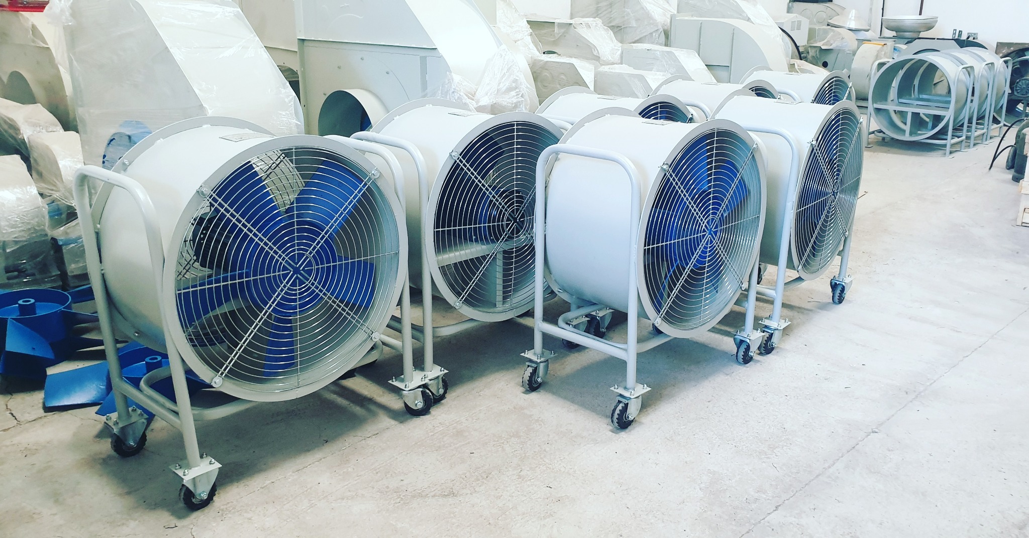Portable fans on wheeled stands
